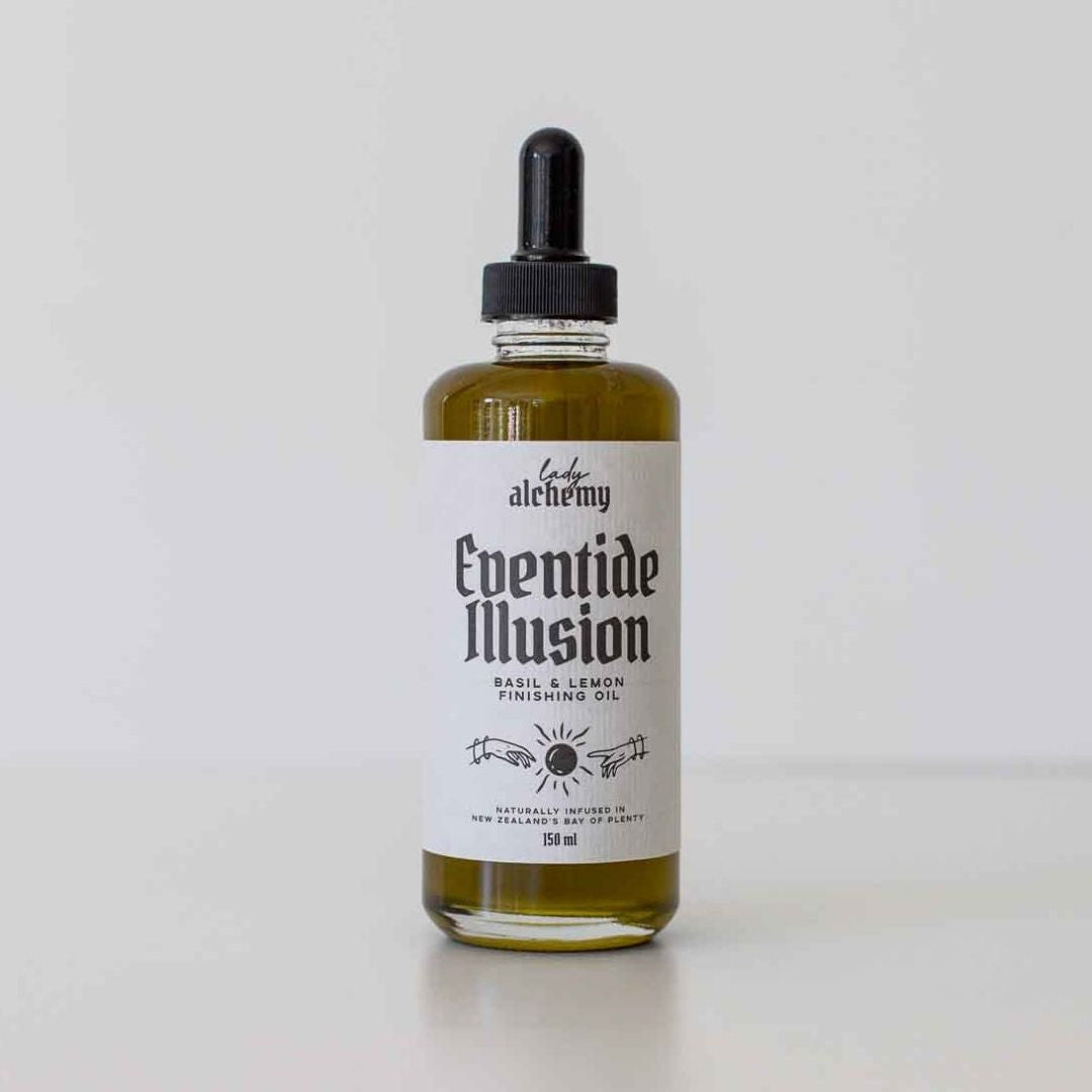 Bottle of 'Eventide Illusion' basil and lemon oil with a dropper on a white background