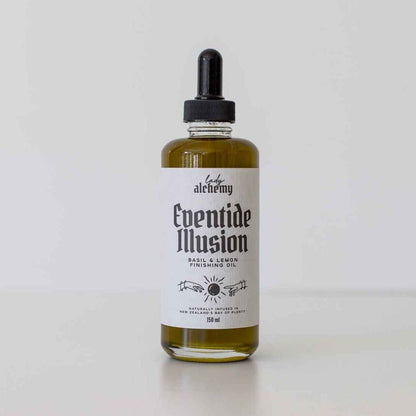 Bottle of 'Eventide Illusion' basil and lemon oil with a dropper on a white background